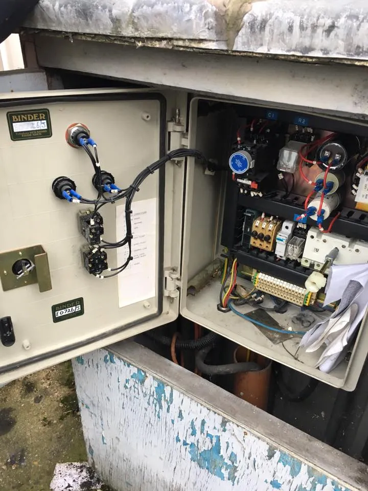 an electrical box with a bunch of wires in it