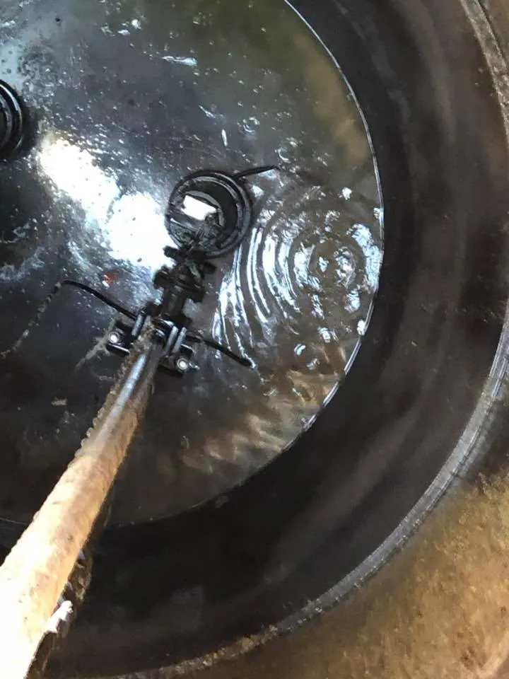 a close up of a frying pan with a wooden handle